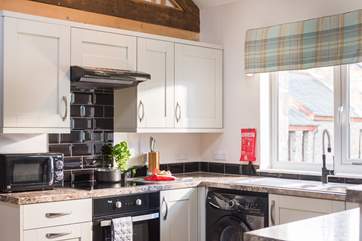 The kitchen is to the front of the barn and overlooks the parking area.