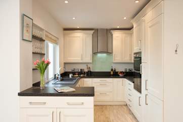 Cook up a family treat in the fully equipped kitchen.