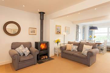 The cosy living-room has ample seating for everyone to relax together.