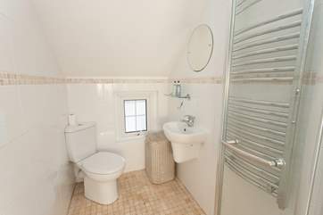 Complete with under-floor heating, this small but cleverly laid out wet-room is perfect for an awakening morning shower.