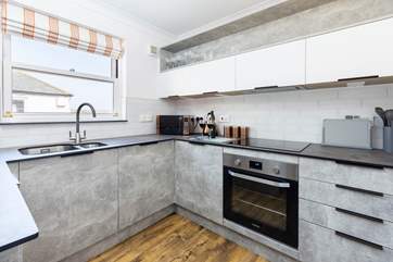 There is everything you might need in this stylish kitchen.