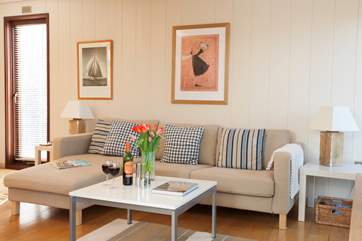The beautiful open plan living-room is a lovely and cosy space to come back to and relax in.