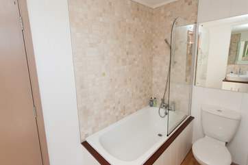 The family bathroom is perfect to wash away the sand from in between your toes.