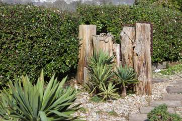 The garden is full of interesting and exotic plants and features.