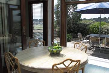 Grab a glass of wine and relax in the conservatory. which has spectacular views across the harbour.