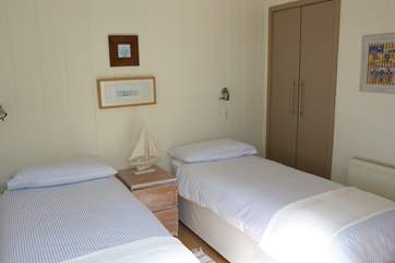 Whether you are bringing children, friends or family, the twin bedroom is an ideal, well decorated second bedroom.