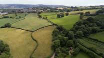 Encompassed by peaceful patchwork farmland.