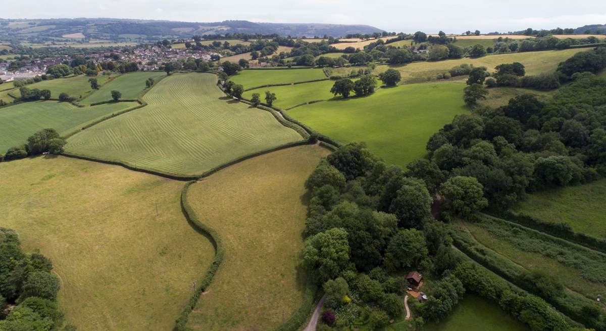 Encompassed by peaceful patchwork farmland.