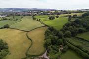 Encompassed by peaceful patchwork farmland.