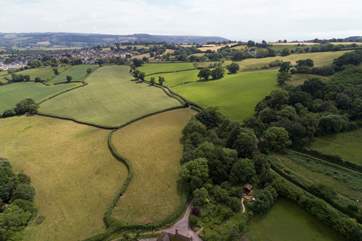 This view shows the farm and parking-area at the bottom of the picture and Orchard Cabin to the right.