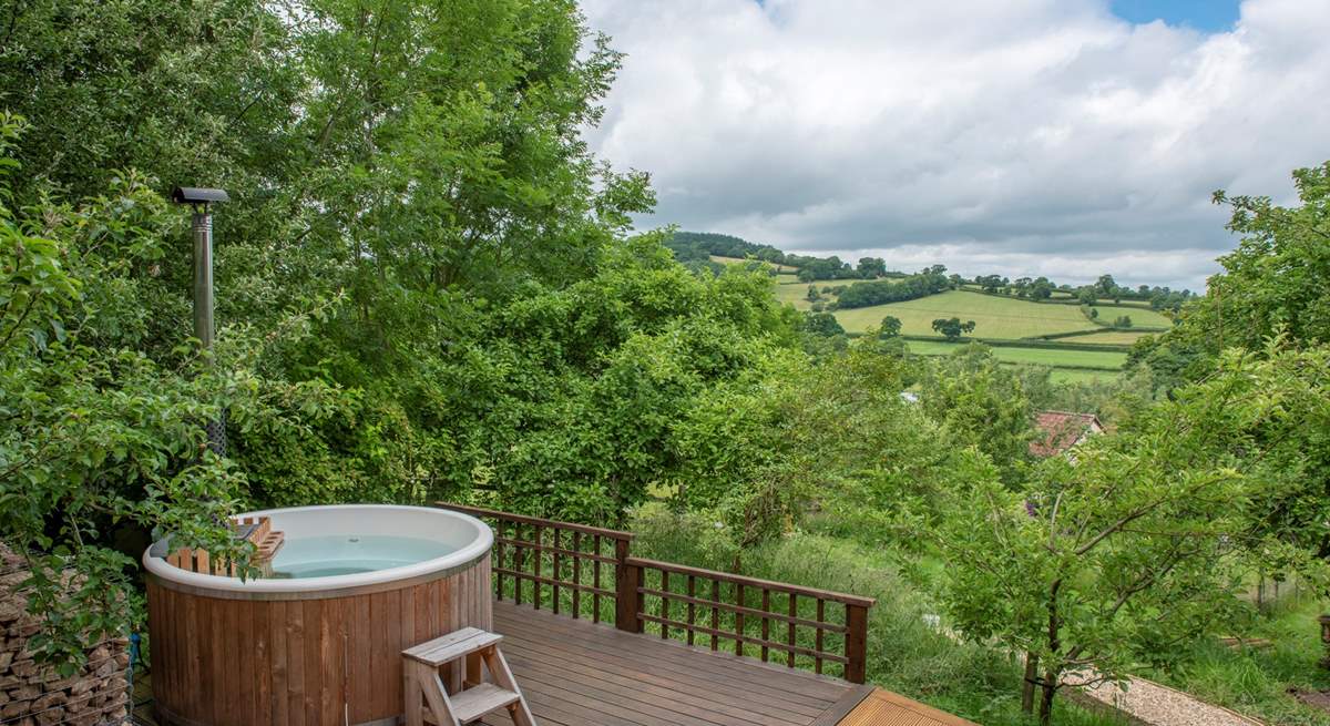 Soak up the stunning countryside views from your dreamy hot tub. 