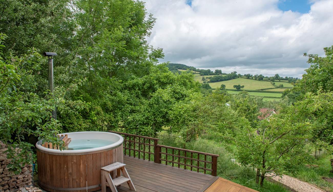 Soak up the stunning countryside views from your dreamy hot tub. 