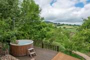 Soak up the stunning countryside views from your dreamy hot tub.