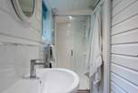 The en suite shower-room has a large shower cubicle, heated towel rail, wash-basin and WC.