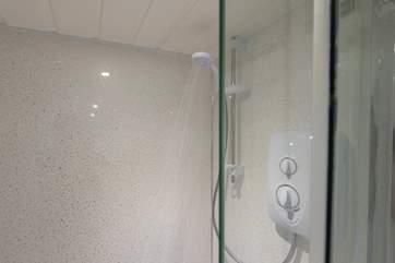 The electric shower gives instant hot water.