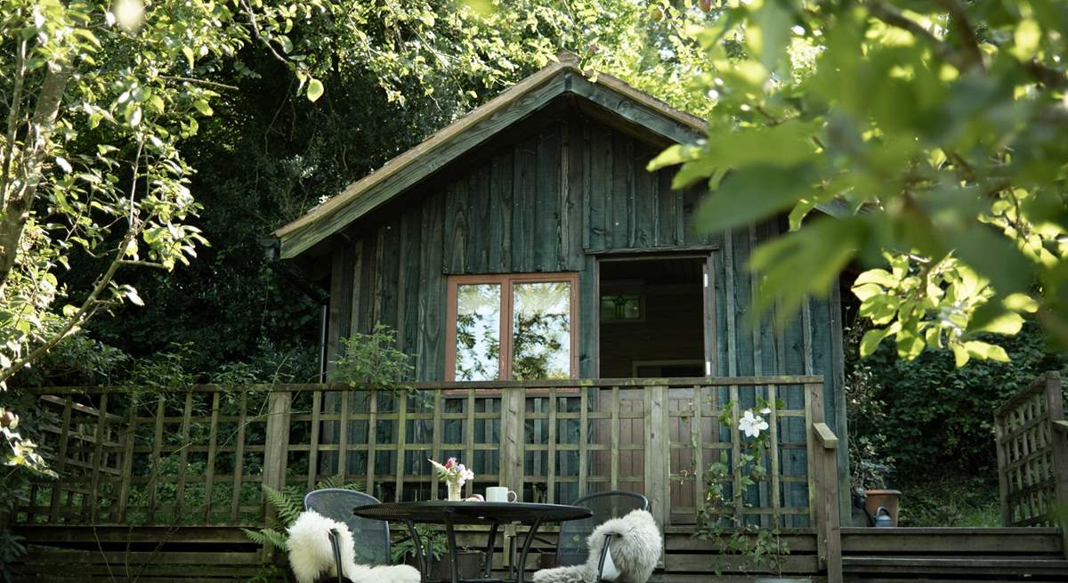 Snuggled into the hillside, Old Orchard Cabin is the most enchanting escape back to nature.