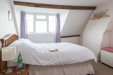 The double bedroom on the second floor is a good light space with views across to Culver Downs.
