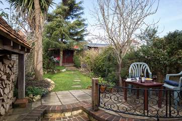 Open up the patio doors into the cute little garden.