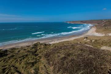 No Place is set above the white sand and blue seas at Sennen Cove (not the view from the property).