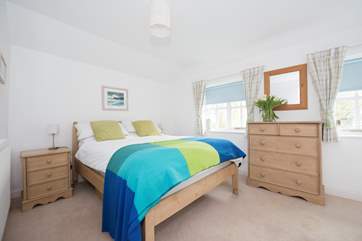 Bedroom 1 with a double bed and en suite shower-room.