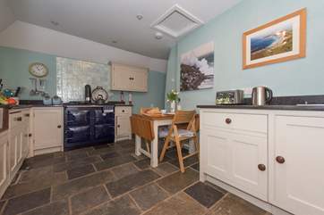 The kitchen/diner has an oil-fired range cooker (there is also an electric, 2 ring hob).