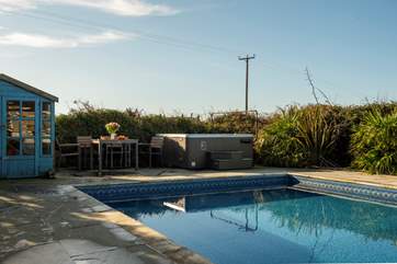 Relax in the hot tub, by the pool.