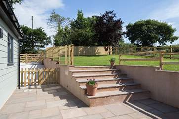 The cottage has the great advantage of this sheltered patio-area, a grassed lawn higher up and gated parking too. Please supervise small children on the steps.