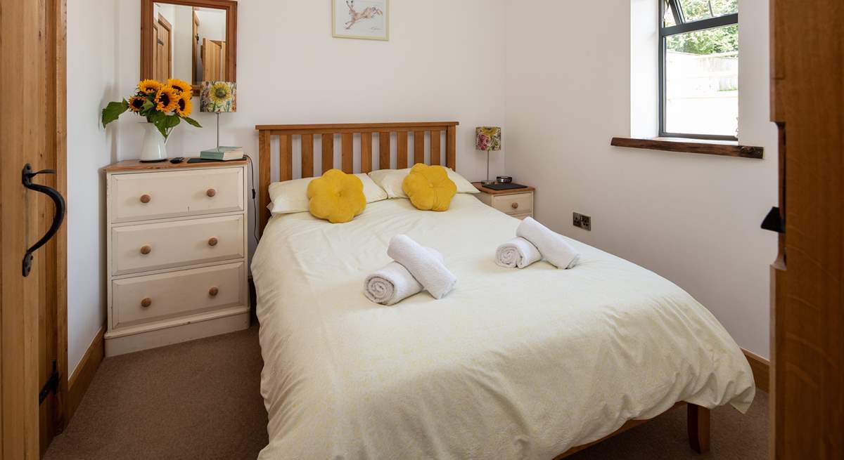 Bedroom one is on the ground floor with a double bed, TV and en suite shower-room.