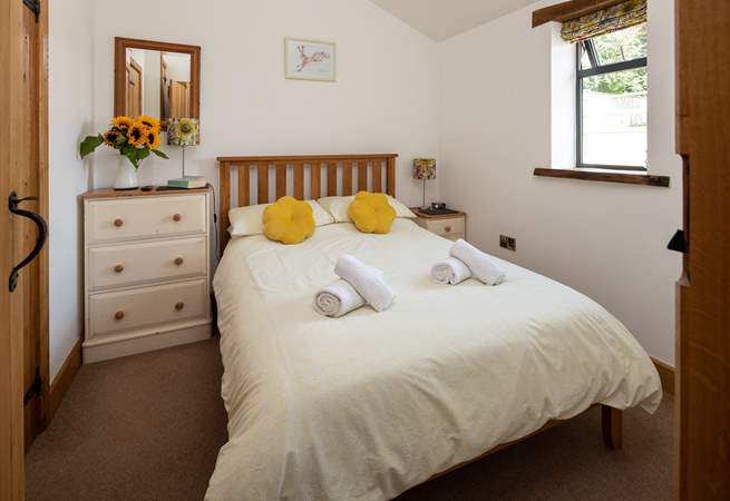 Bedroom one is on the ground floor with a double bed, TV and en suite shower-room.