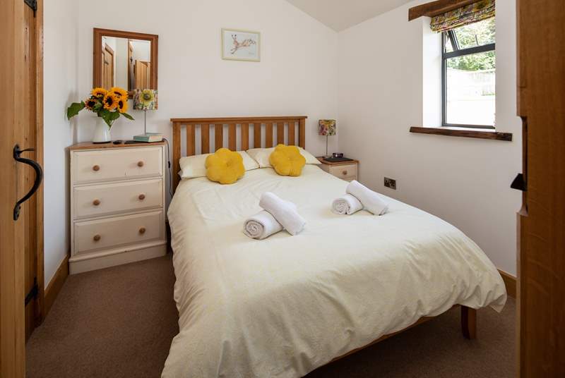 Bedroom one is on the ground floor with a double bed, TV and en suite shower-room.