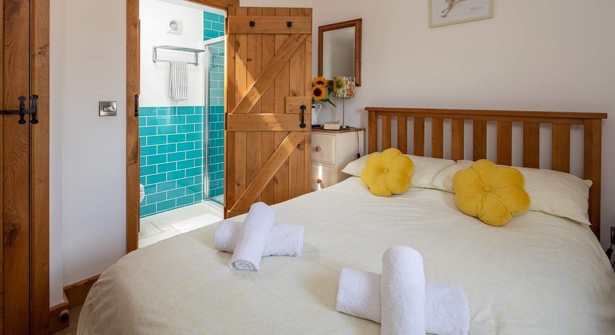 Bedroom one on the ground floor has a double bed and en suite shower-room.