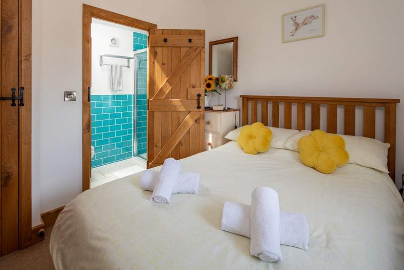 Bedroom one on the ground floor has a double bed and en suite shower-room.