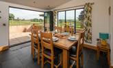 The dining-area enjoys the best of the views - that is if you are not eating outside in the fresh air. - Thumbnail Image