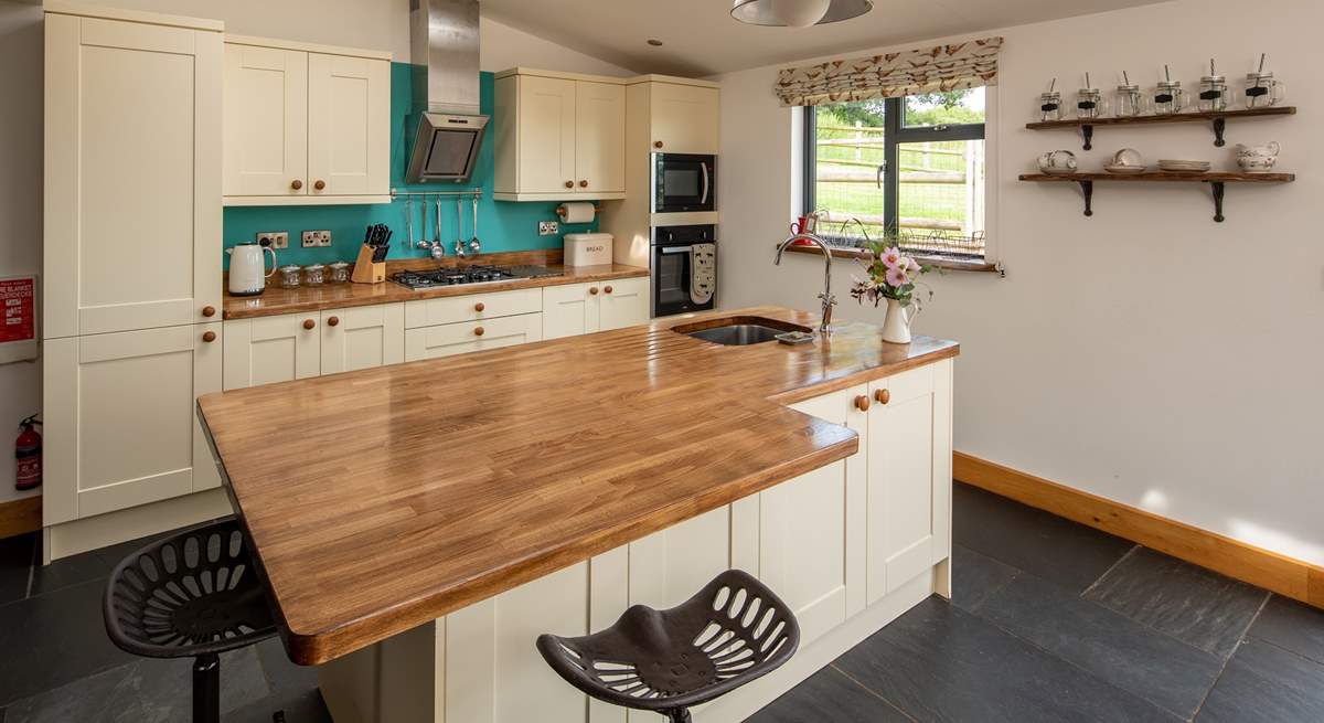 The kitchen-area also has a huge island/breakfast-bar.