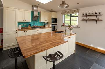 The kitchen-area also has a huge island/breakfast bar.