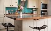 The island in the kitchen is perfect for those pre dinner drinks and nibbles. - Thumbnail Image