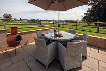 Dine al fresco surrounded by gorgeous countryside views.