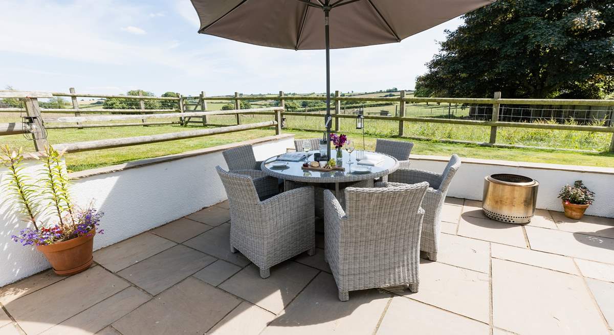 Dine al fresco surrounded by gorgeous countryside views.