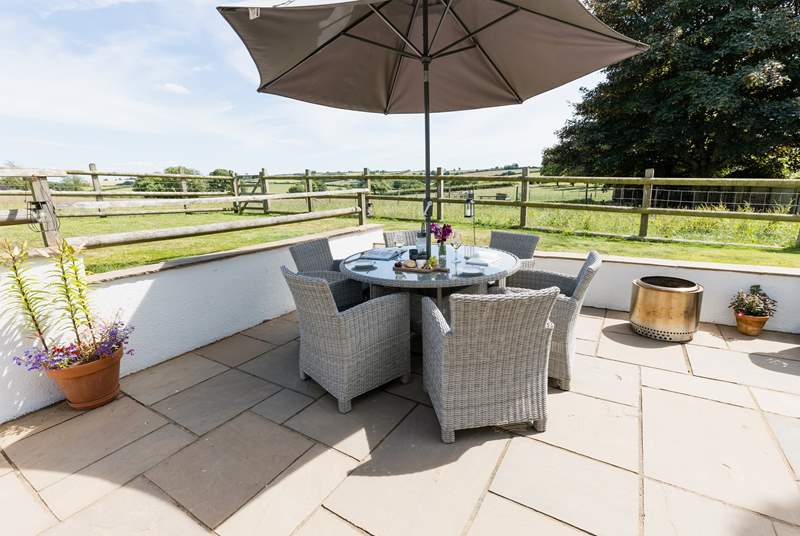 Dine al fresco surrounded by gorgeous countryside views.