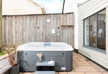 Just outside the dining area, you can bubble away in this fabulous hot tub. 