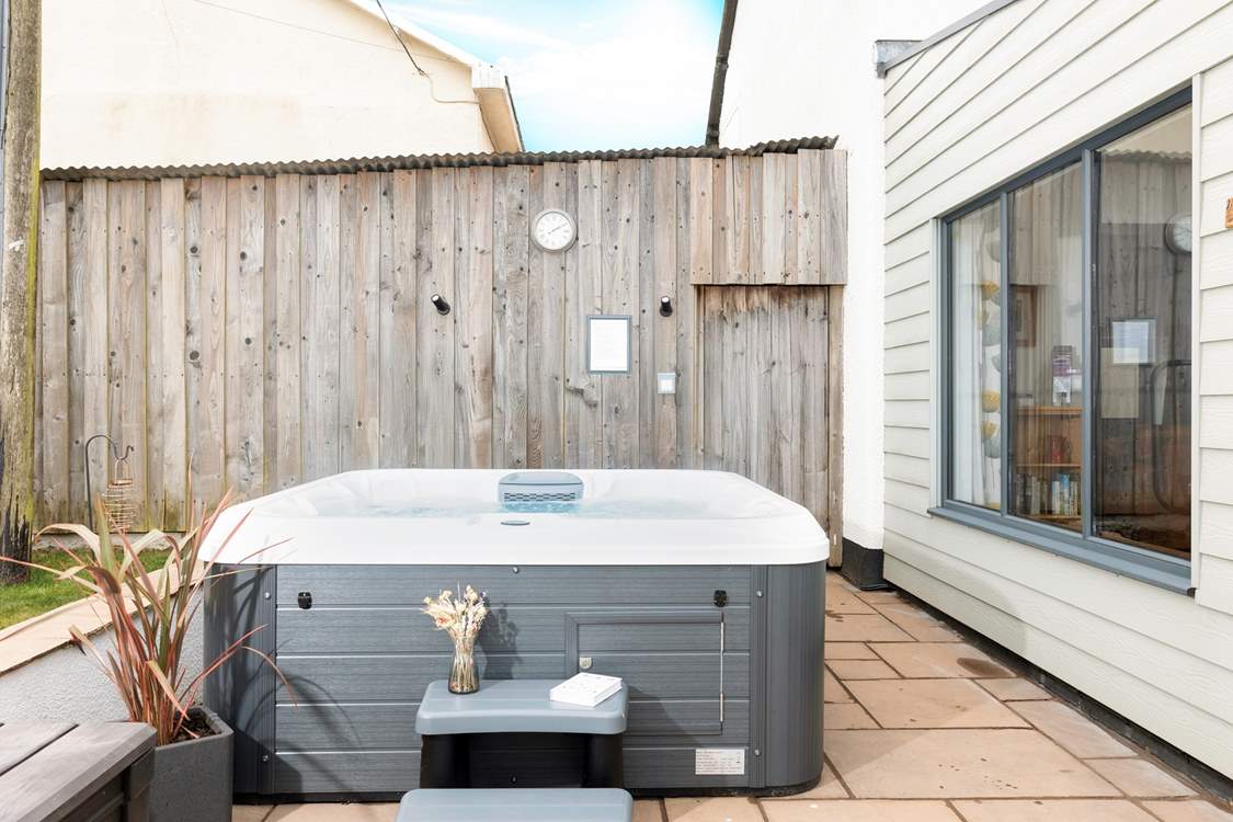 Just outside the dining area, you can bubble away in this fabulous hot tub.