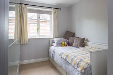 Bedroom 3 looks out over the garden and has a truckle bed, which has a second mattress beneath, suitable for sleeping two children.