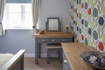 Another view of Bedroom 1 which looks out at the terrrace at the back of the cottage.