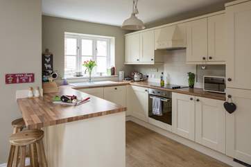 The open plan kitchen is very well-equipped and has plenty of space to create some delicious holiday treats.