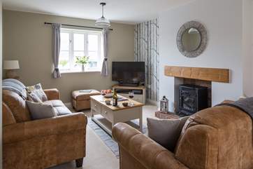 The sitting-area has books, games and a wood-burner effect electric stove for cosy winter evenings.