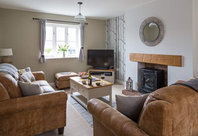 The sitting-area has books, games and a wood-burner effect electric stove for cosy winter evenings.