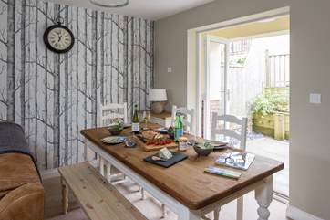 The dining-area has French doors that lead out to the fully enclosed raised terrace.