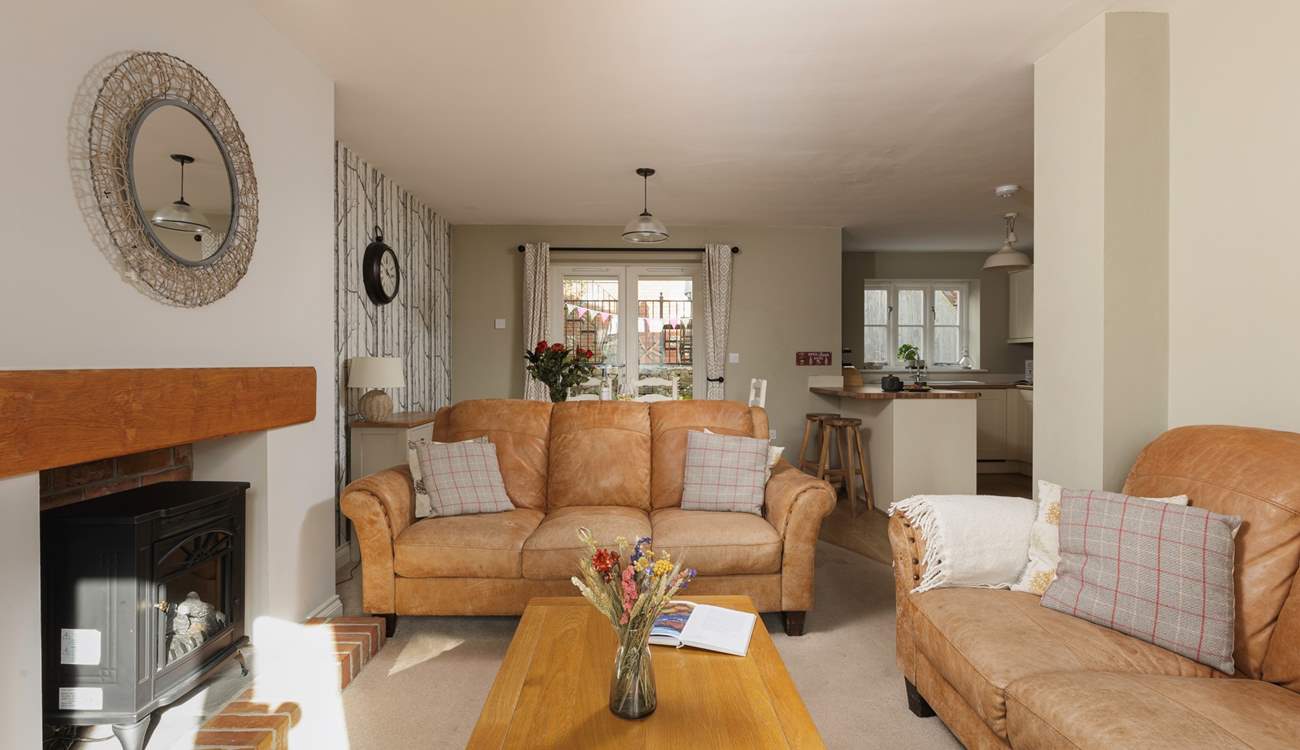 The sitting-area has books, games and a wood-burner effect electric stove for cosy winter evenings.