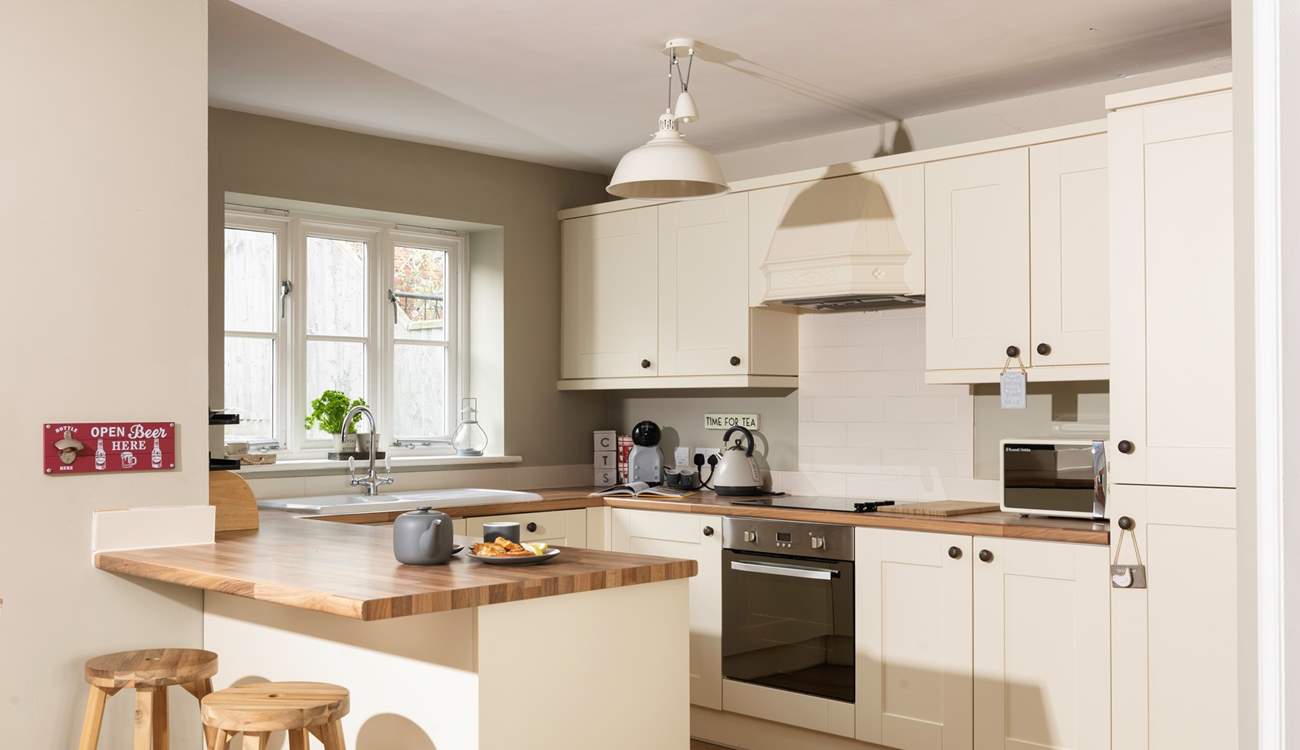 The open plan kitchen is very well-equipped and has plenty of space to create some delicious holiday treats.