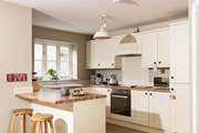 The open plan kitchen is very well-equipped and has plenty of space to create some delicious holiday treats.